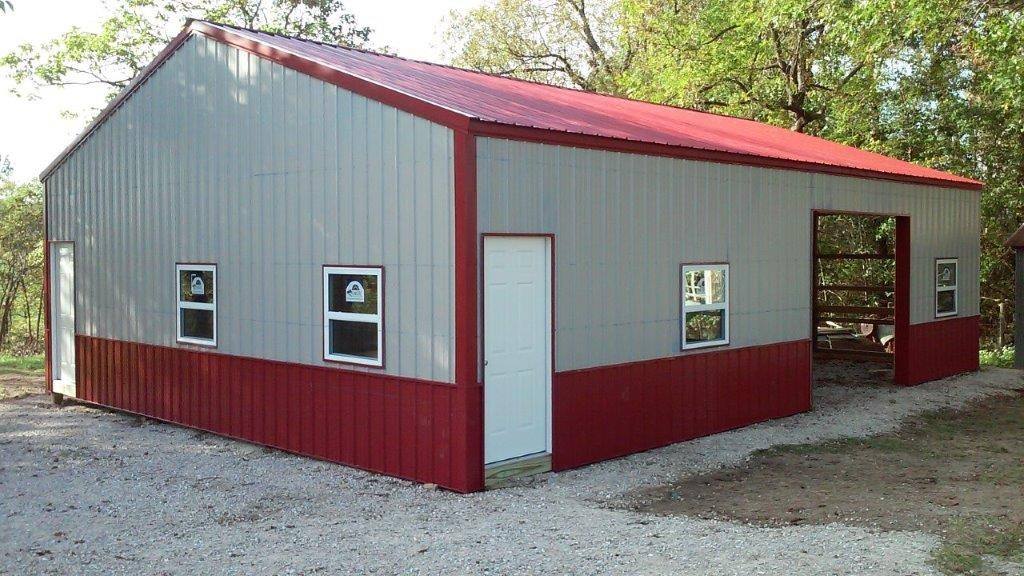 A Lucky pole barn in gray with red trim, a red roof and red wainscot